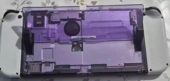Switch OLED avec coque arrière violette transparente